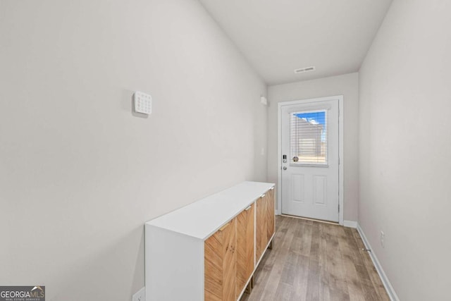 doorway with light hardwood / wood-style floors