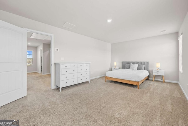 bedroom featuring light carpet