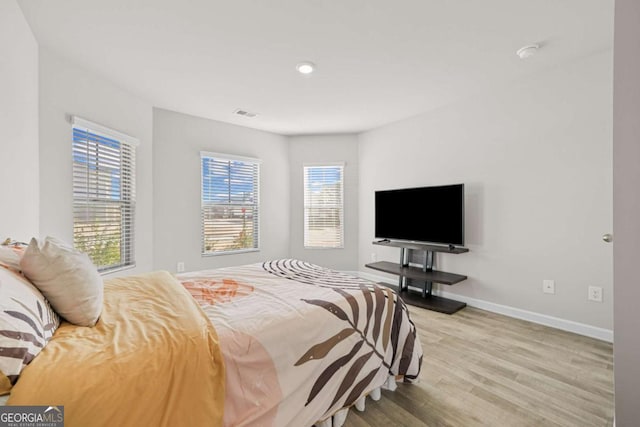 bedroom with light hardwood / wood-style flooring