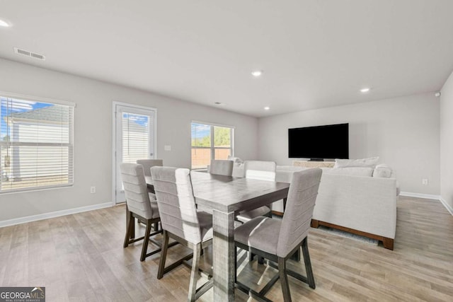 dining room with light wood-type flooring