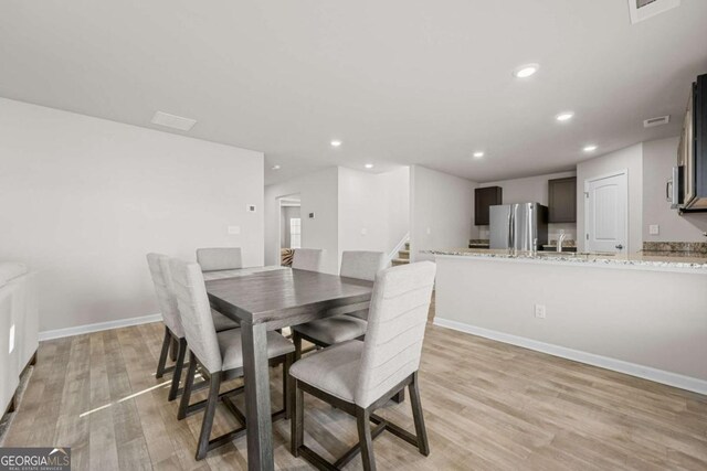 dining room featuring light wood-type flooring