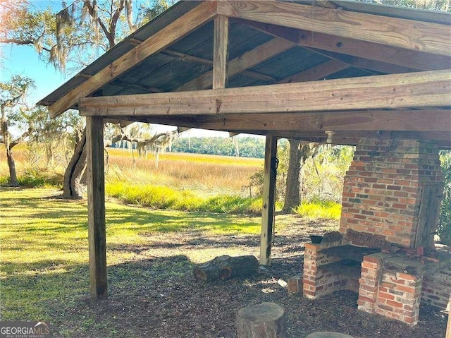 view of yard with a rural view