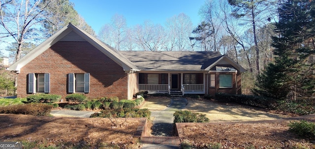 1030 Lake Haynes Dr NE, Conyers, GA 30012 - ranch-style home with a porch and brick siding