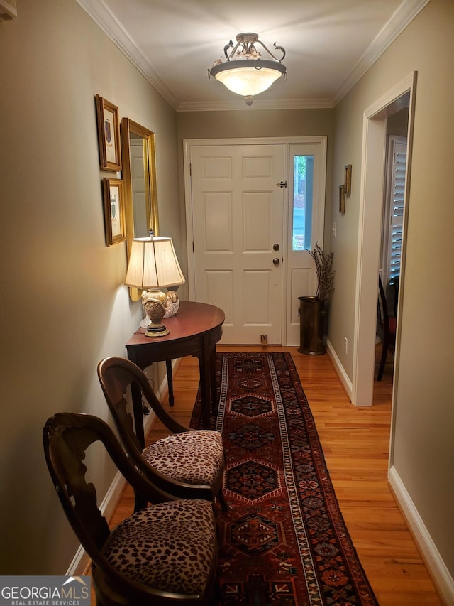 1030 Lake Haynes Dr NE, Conyers, GA 30012 - doorway with light wood finished floors, baseboards, and crown molding