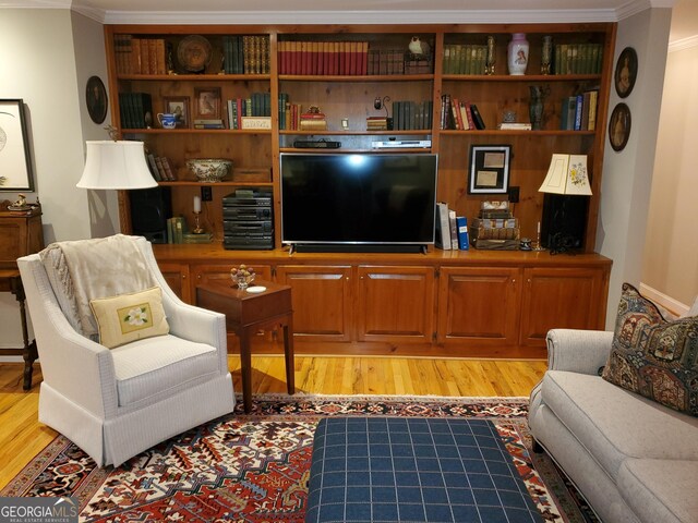 1030 Lake Haynes Dr NE, Conyers, GA 30012 - living room featuring crown molding and light wood-type flooring
