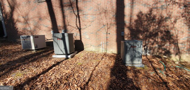 1030 Lake Haynes Dr NE, Conyers, GA 30012 - details with central air condition unit and brick siding