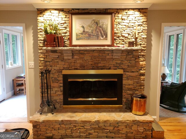 1030 Lake Haynes Dr NE, Conyers, GA 30012 - interior details featuring baseboards, ornamental molding, wood finished floors, and a fireplace