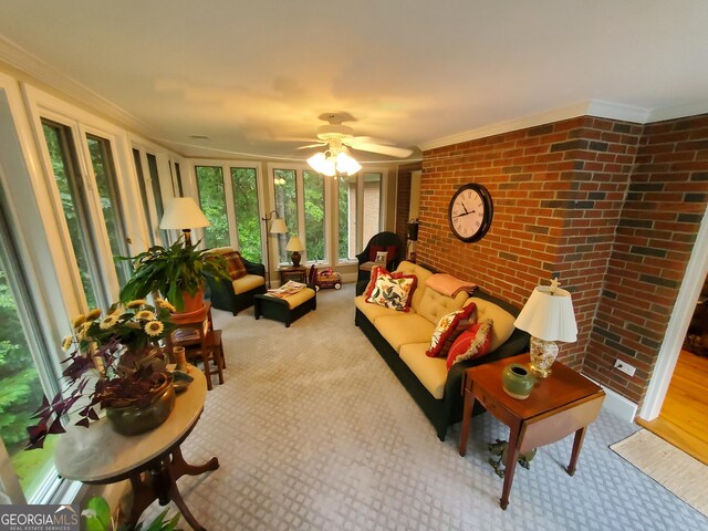 1030 Lake Haynes Dr NE, Conyers, GA 30012 - carpeted living room featuring brick wall, ceiling fan, and crown molding