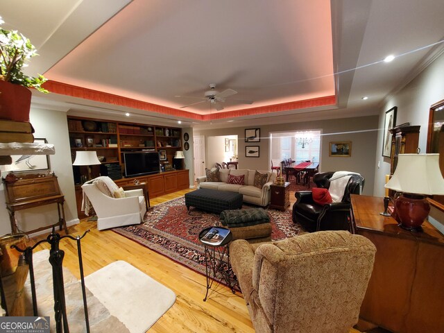 1030 Lake Haynes Dr NE, Conyers, GA 30012 - living room featuring recessed lighting, a raised ceiling, light wood-style flooring, and a ceiling fan