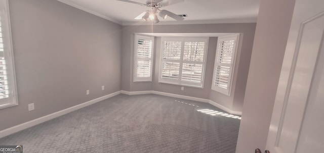 empty room featuring carpet floors, ceiling fan, and ornamental molding