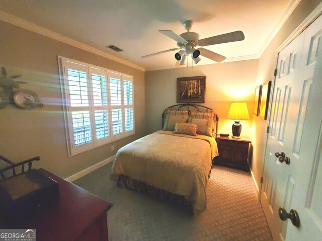 1030 Lake Haynes Dr NE, Conyers, GA 30012 - carpeted bedroom featuring visible vents, crown molding, baseboards, and a ceiling fan