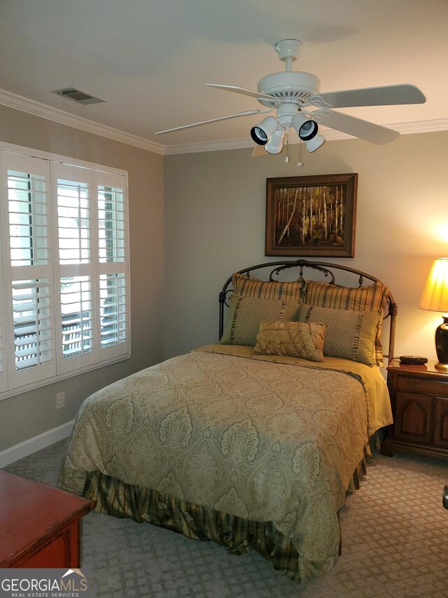 1030 Lake Haynes Dr NE, Conyers, GA 30012 - carpeted bedroom featuring ceiling fan, visible vents, and ornamental molding