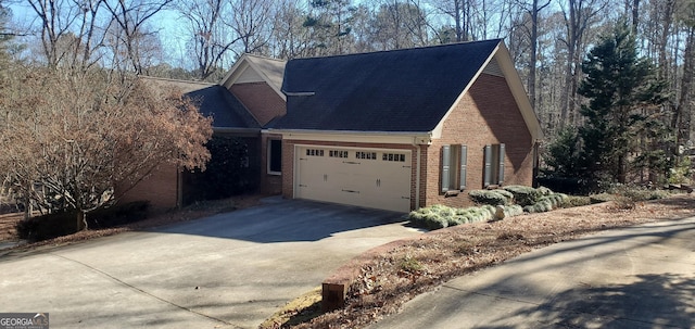 view of side of property with a garage