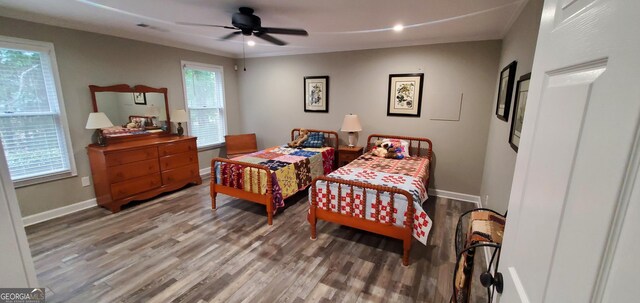 1030 Lake Haynes Dr NE, Conyers, GA 30012 - bedroom featuring wood finished floors, baseboards, and multiple windows