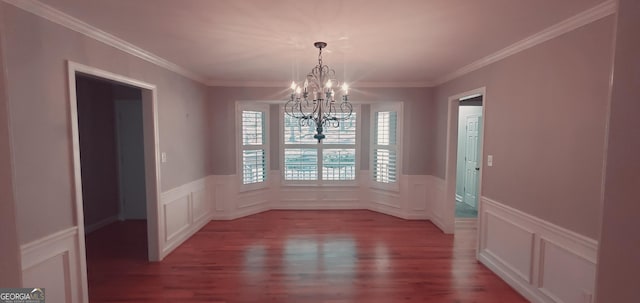 unfurnished dining area with light wood-type flooring, an inviting chandelier, and ornamental molding