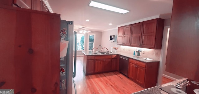 kitchen featuring dishwasher, light wood-type flooring, kitchen peninsula, and crown molding