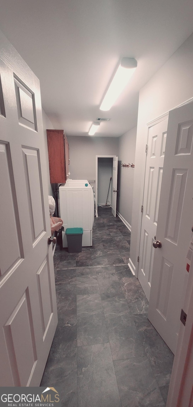 laundry room with cabinets