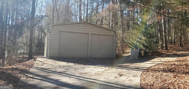 1030 Lake Haynes Dr NE, Conyers, GA 30012 - detached garage with a wooded view