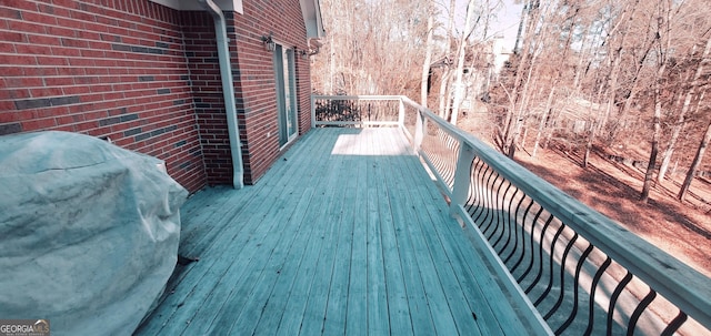 wooden terrace with grilling area