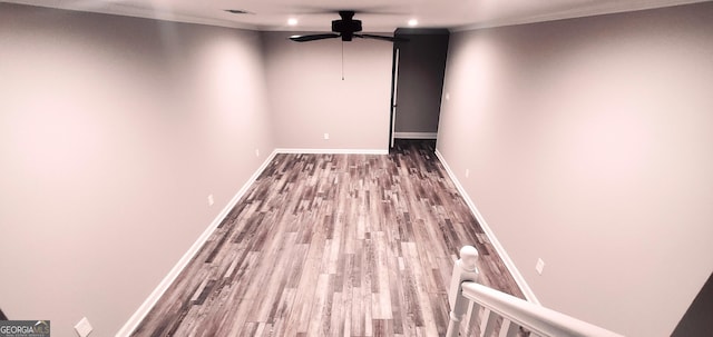 interior space featuring hardwood / wood-style floors, ceiling fan, and ornamental molding