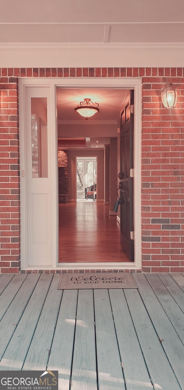 1030 Lake Haynes Dr NE, Conyers, GA 30012 - doorway to property with brick siding and a deck