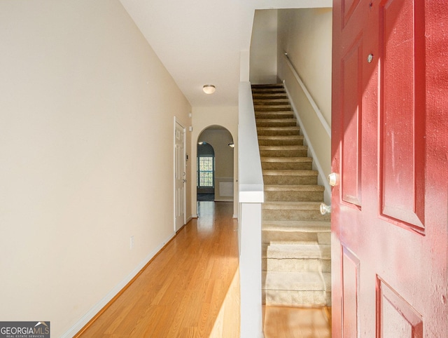 staircase featuring hardwood / wood-style floors