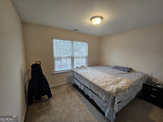 bedroom featuring light carpet