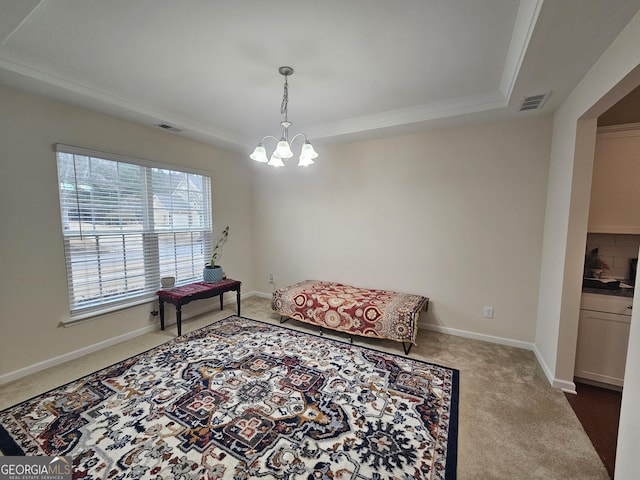 sitting room featuring carpet flooring, a raised ceiling, and an inviting chandelier