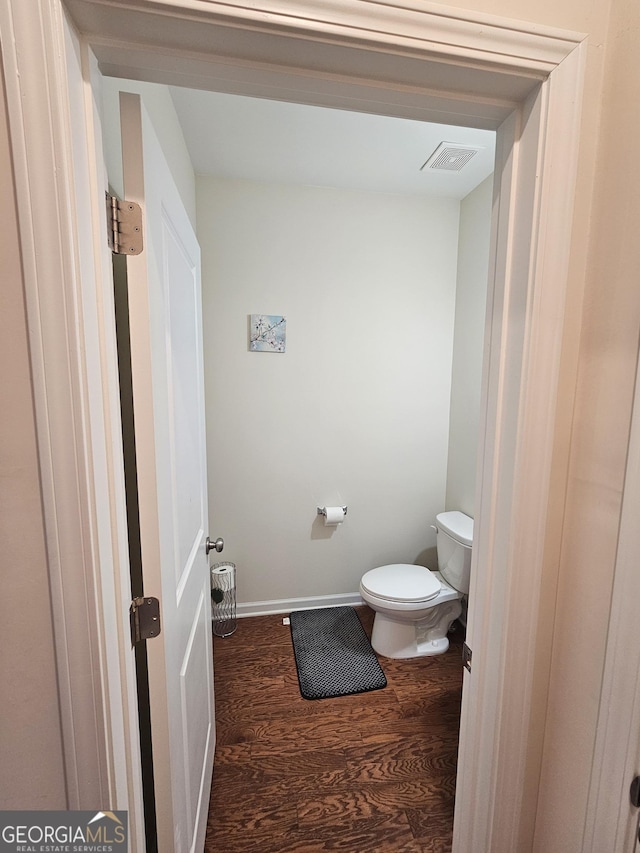 bathroom featuring toilet and hardwood / wood-style floors