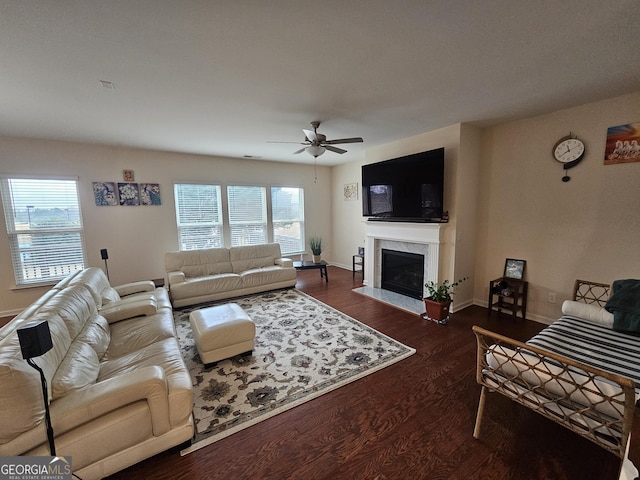 living room with ceiling fan and dark hardwood / wood-style floors