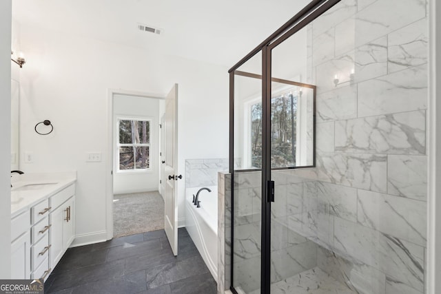 bathroom featuring plus walk in shower and vanity