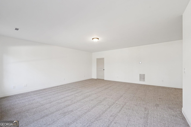 spare room with light colored carpet