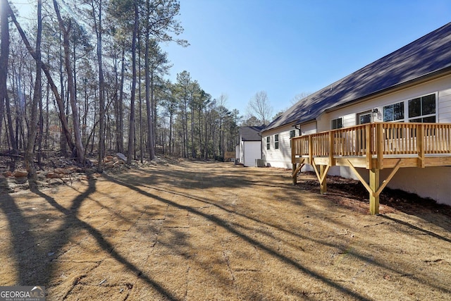 view of yard with a wooden deck