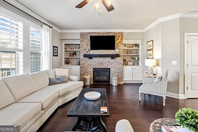 living room featuring a fireplace, ornamental molding, ceiling fan, built in features, and dark hardwood / wood-style flooring