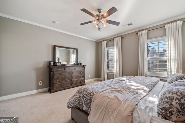 bedroom with ceiling fan, light colored carpet, and ornamental molding