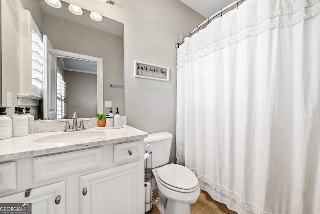 bathroom with vanity and toilet