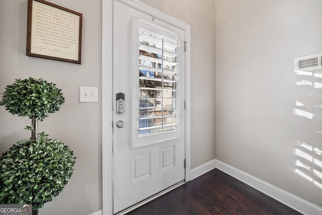 doorway featuring a healthy amount of sunlight and dark hardwood / wood-style floors