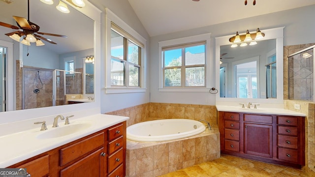 bathroom featuring vanity, ceiling fan, shower with separate bathtub, and vaulted ceiling