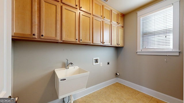 washroom featuring electric dryer hookup, cabinets, sink, and hookup for a washing machine