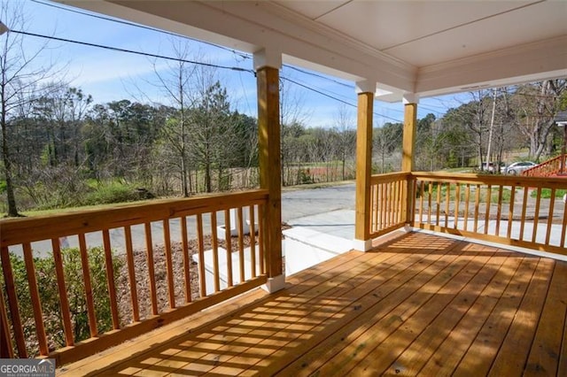 wooden deck featuring covered porch