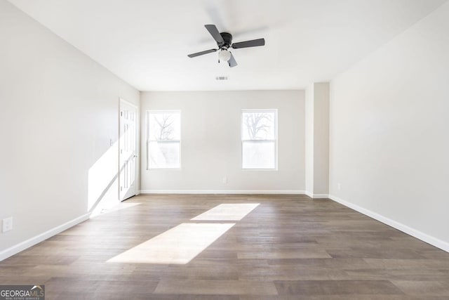 spare room featuring ceiling fan and hardwood / wood-style flooring