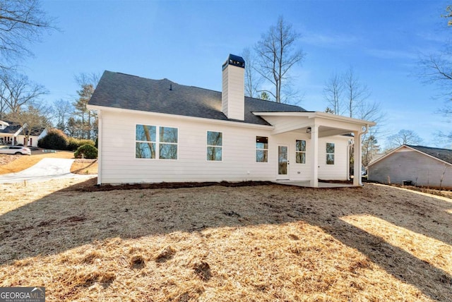 rear view of property featuring a patio area