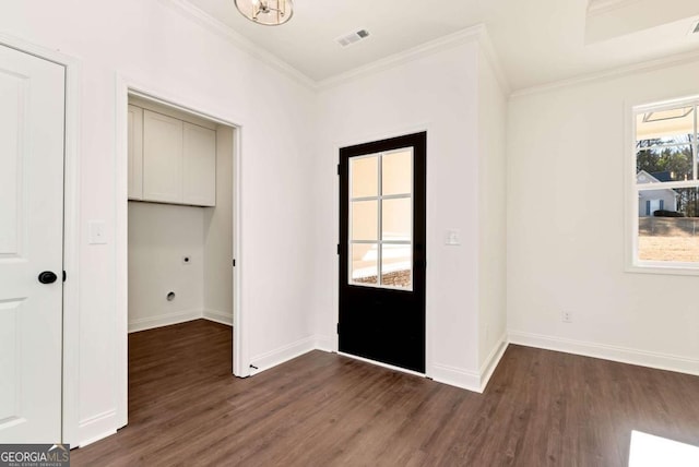 entryway with dark hardwood / wood-style floors and ornamental molding