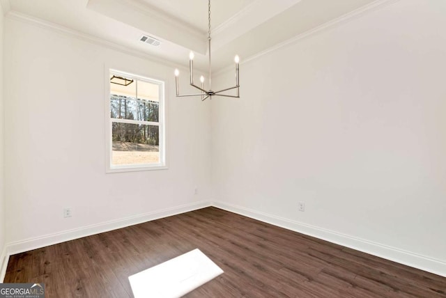 unfurnished dining area featuring an inviting chandelier, a raised ceiling, dark wood-type flooring, and crown molding