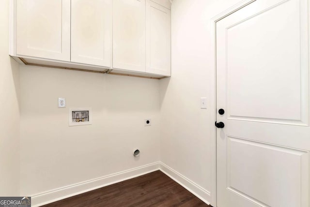 laundry room with hookup for an electric dryer, cabinets, dark wood-type flooring, and washer hookup