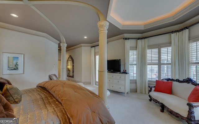 bedroom with light carpet, ornate columns, and crown molding