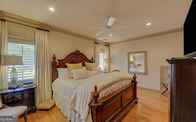 bedroom with multiple windows, ceiling fan, crown molding, and light wood-type flooring