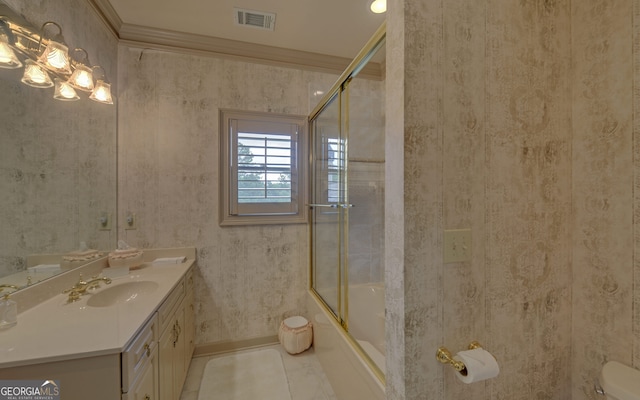 full bathroom with tile patterned floors, ornamental molding, vanity, enclosed tub / shower combo, and toilet