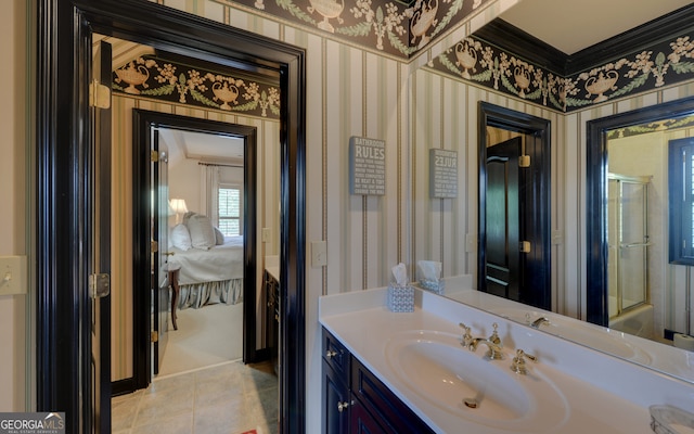 bathroom with tile patterned floors and vanity