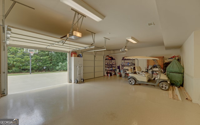 garage featuring a garage door opener